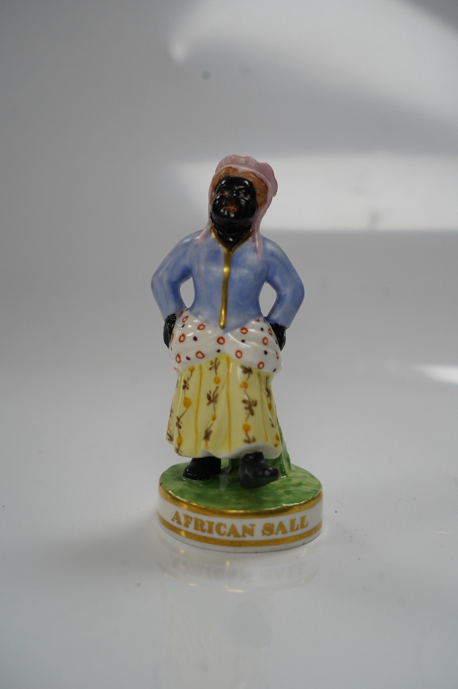 A Derby (Sampson Hancock) porcelain Figurine, 'African Sall', 9cm. Condition - good